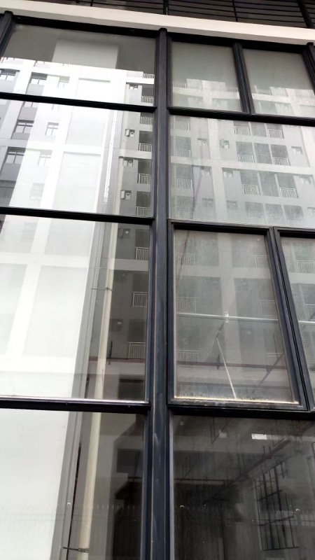 Another before-and-after comparison showing cleaned building surface