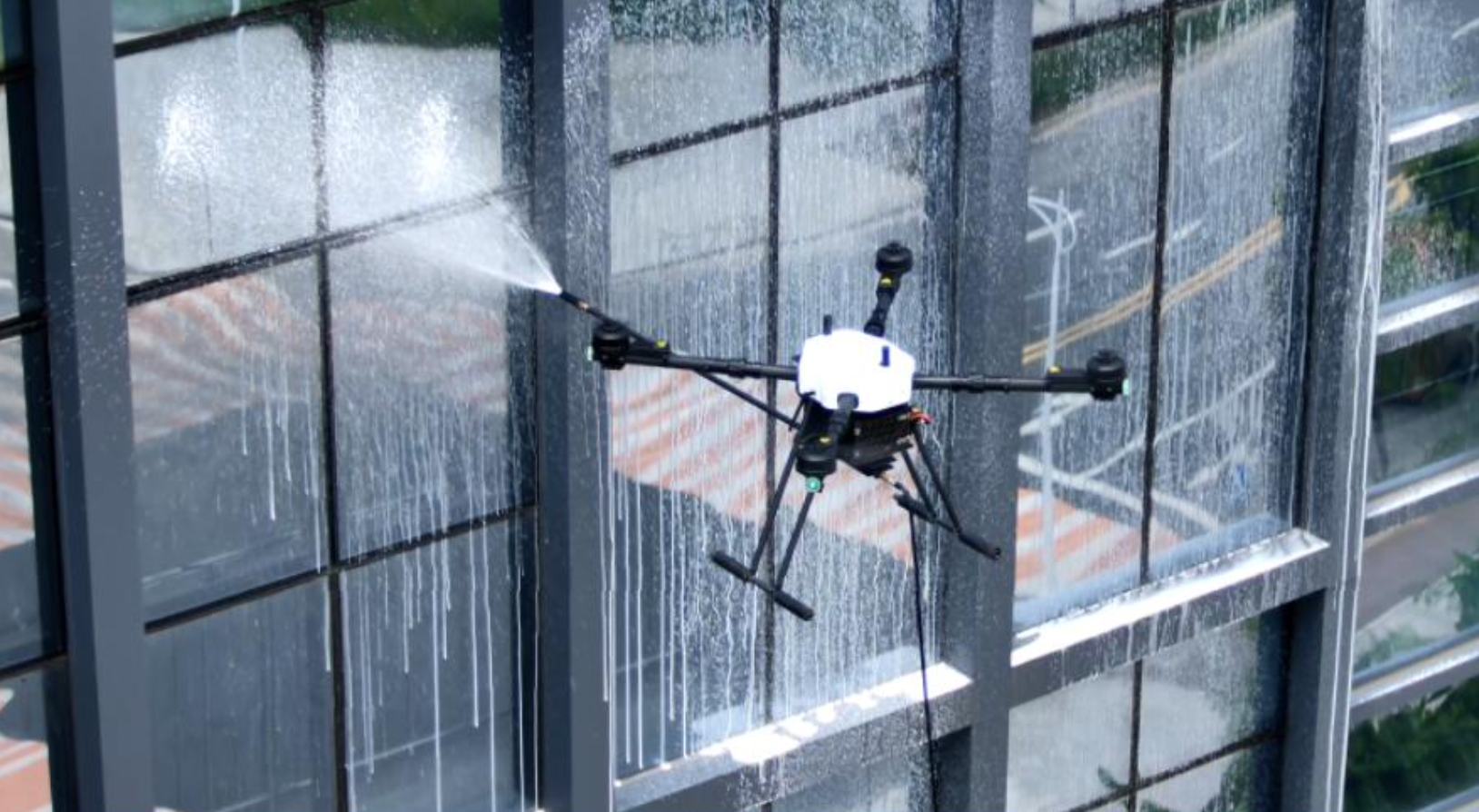 Aerial cleaning system drone with water delivery system