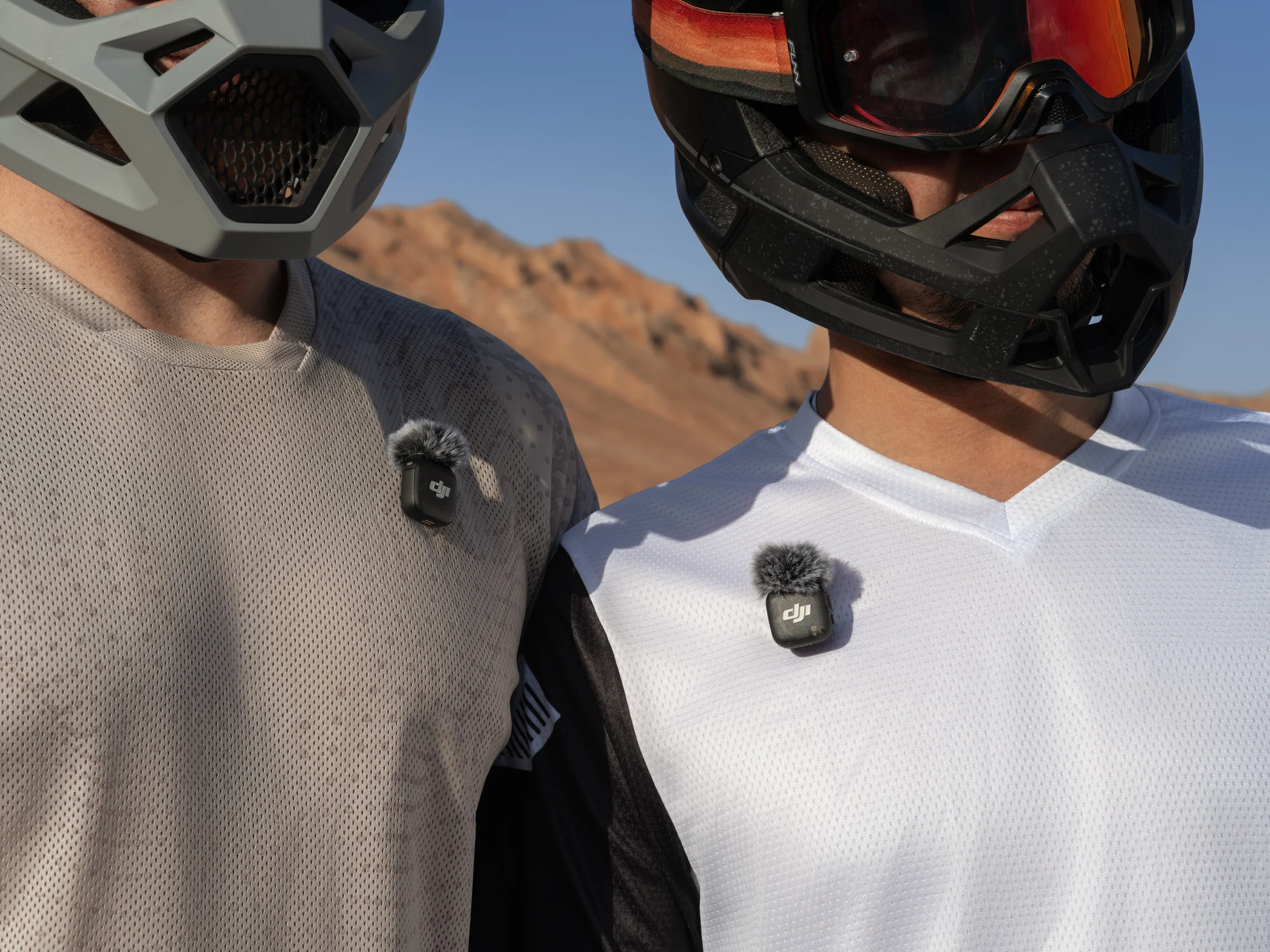 Creators using wireless microphones connected to an action camera