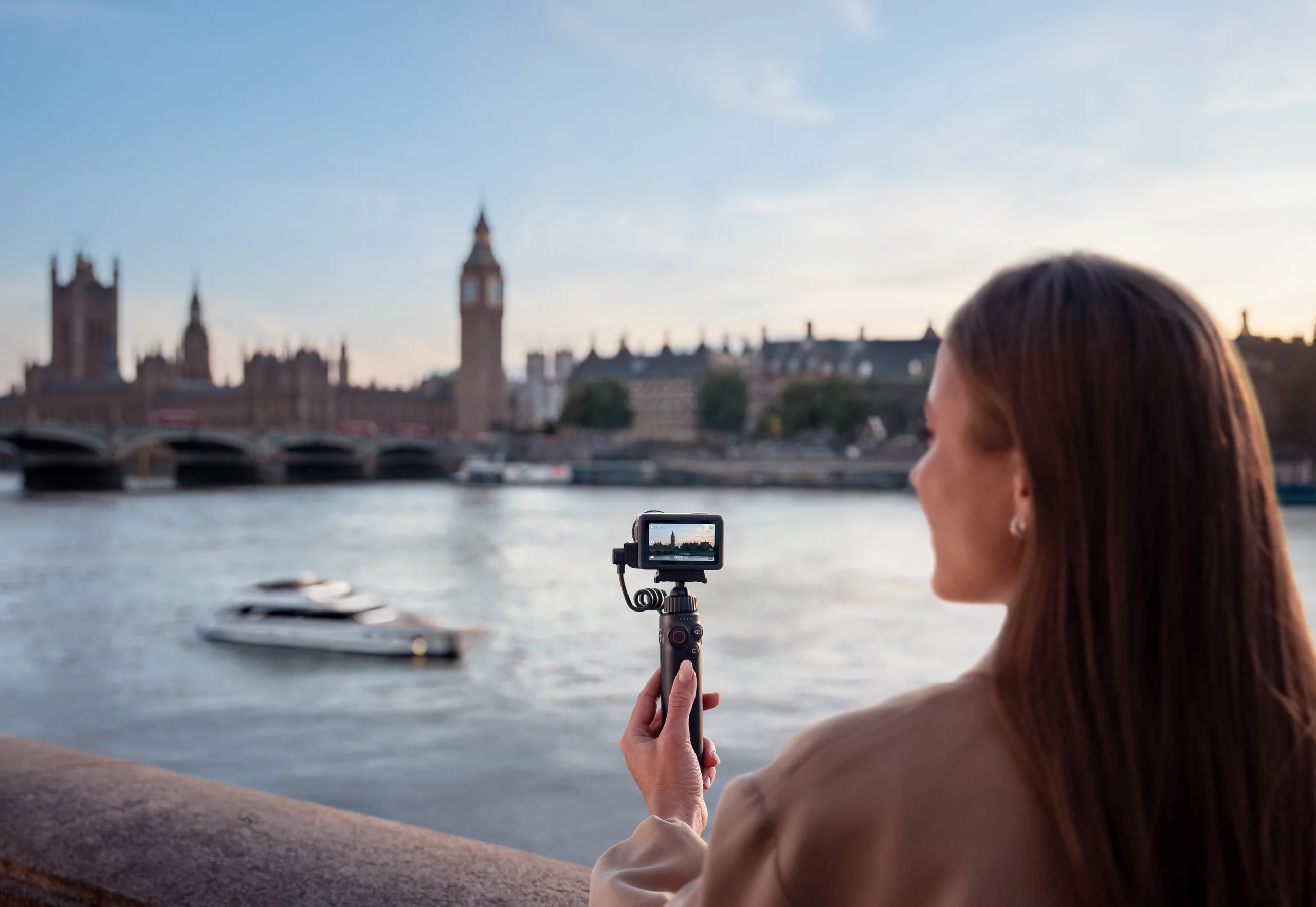 Creator filming a vlog with a DJI Osmo Action camera
