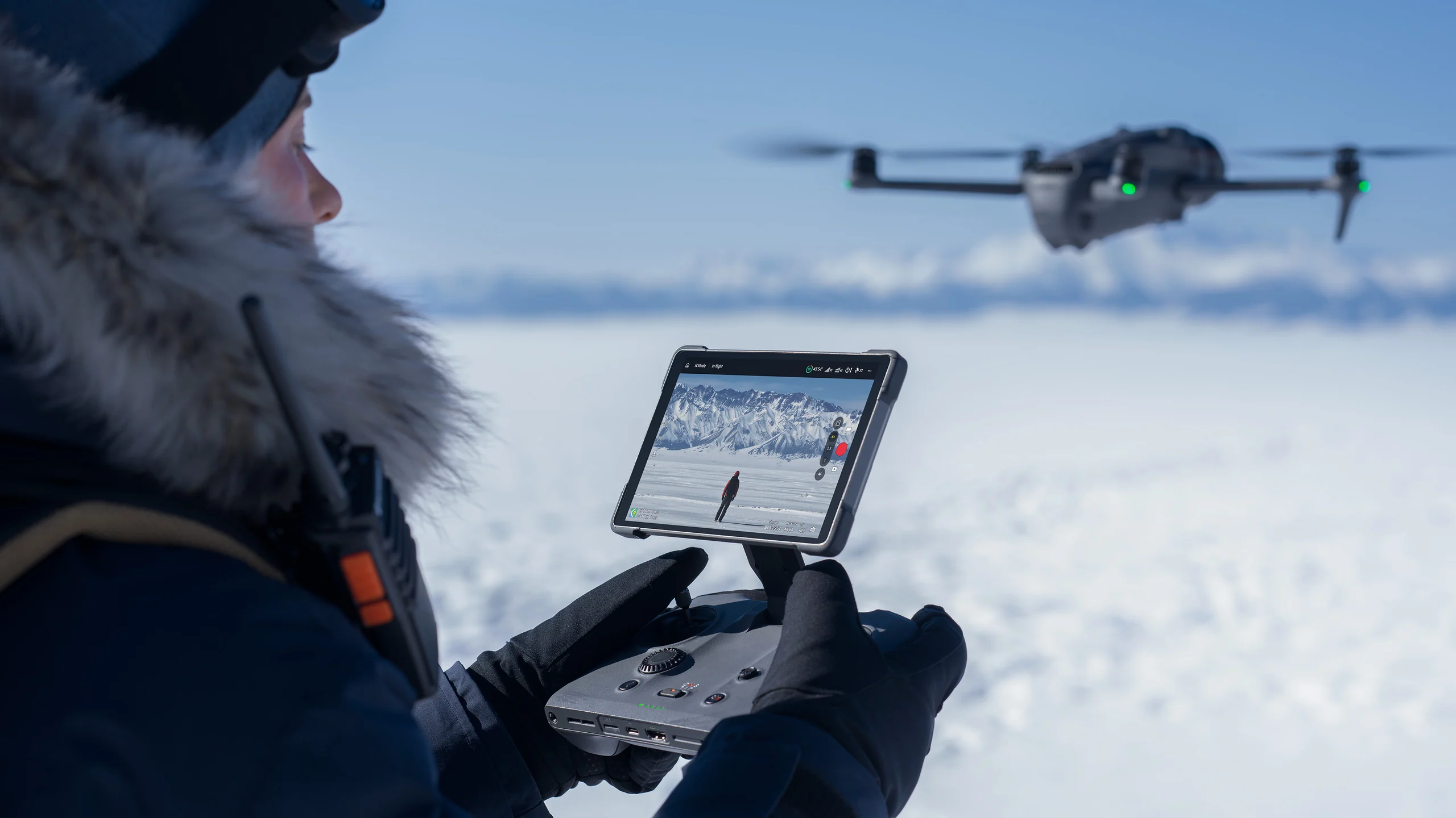 Creator operating DJI Mavic 4 Pro in a snowy landscape