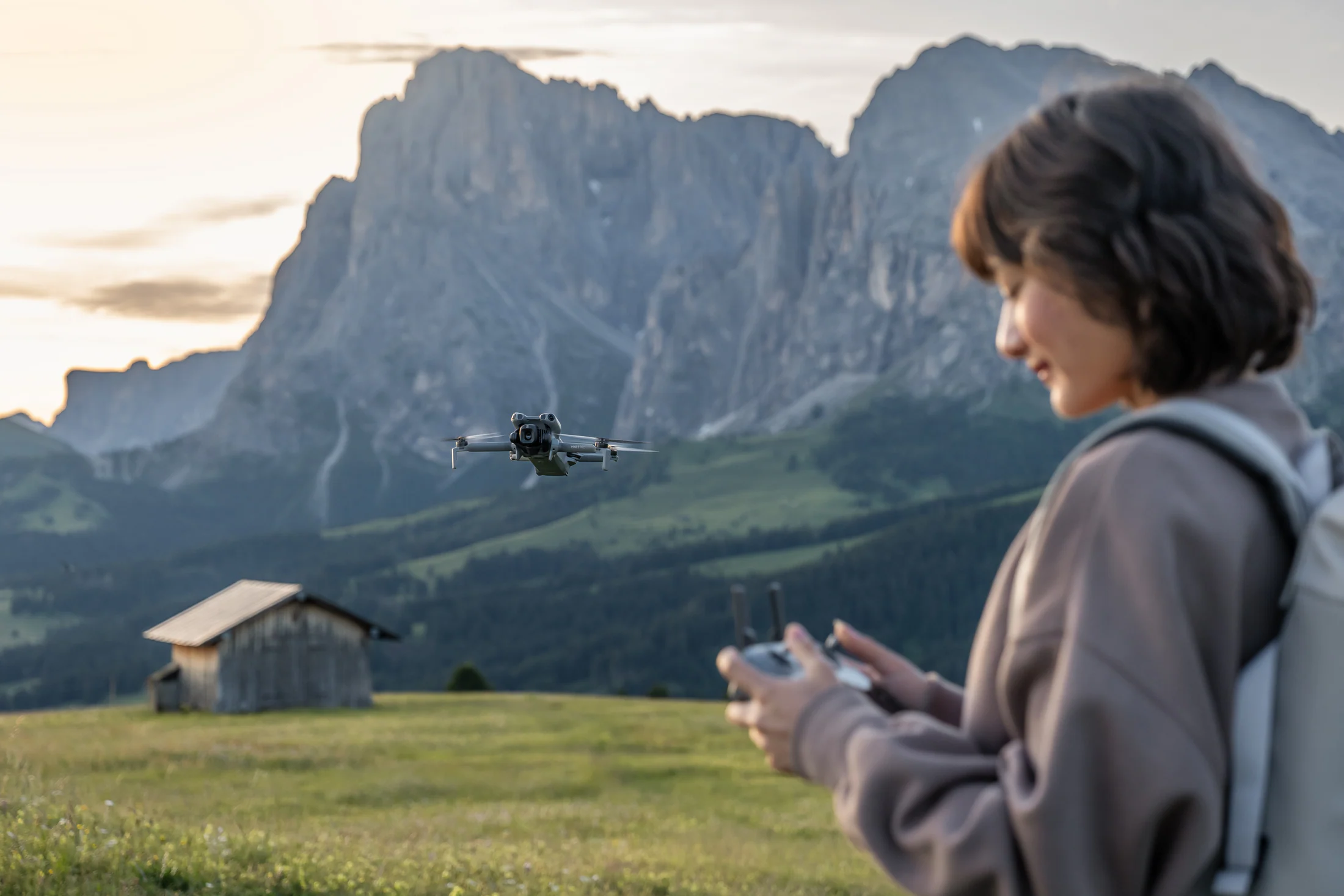 Creator flying DJI Mini 5 Pro during an alpine hike