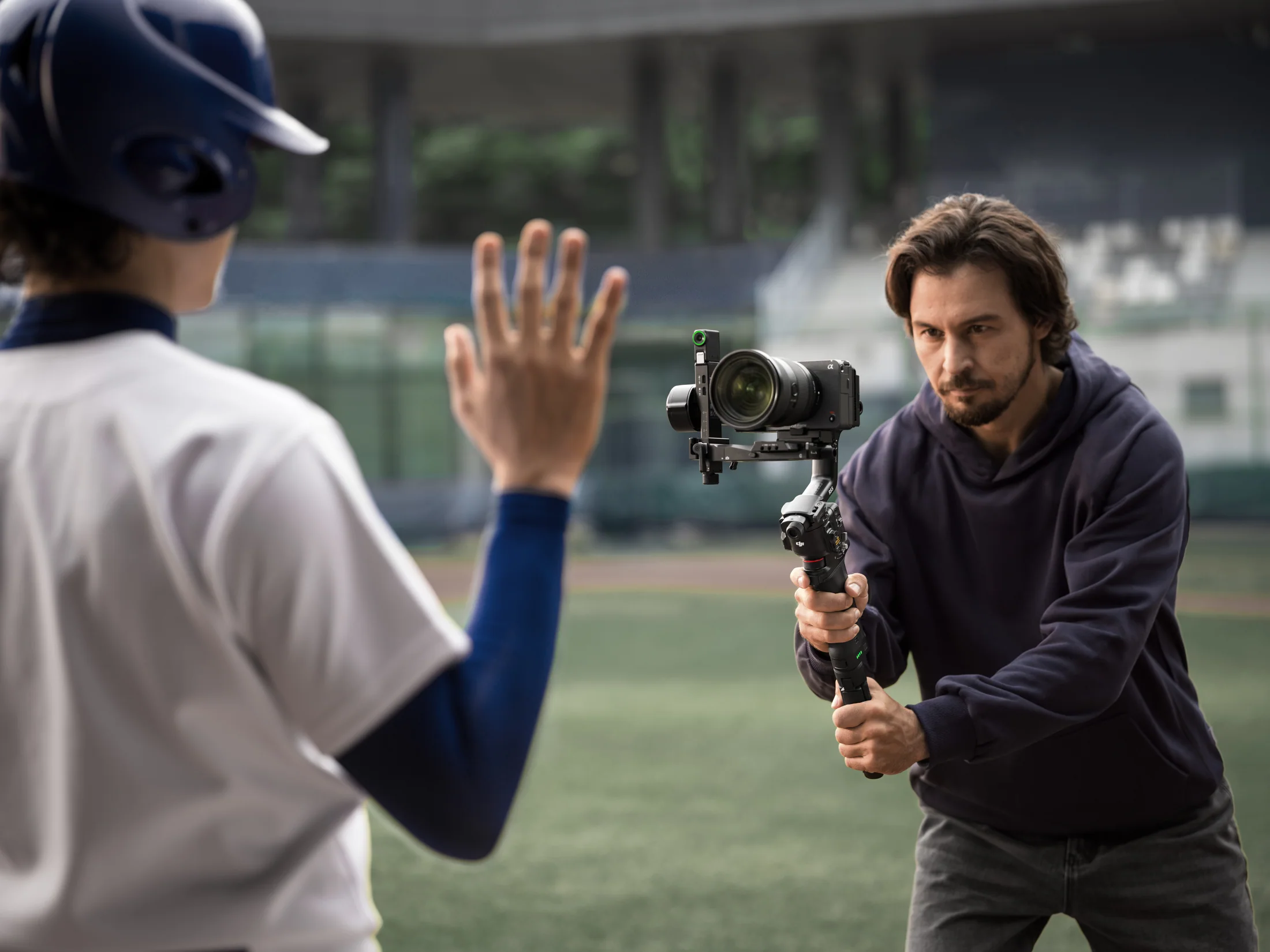 Presenter controlling DJI RS 5 tracking with a hand gesture