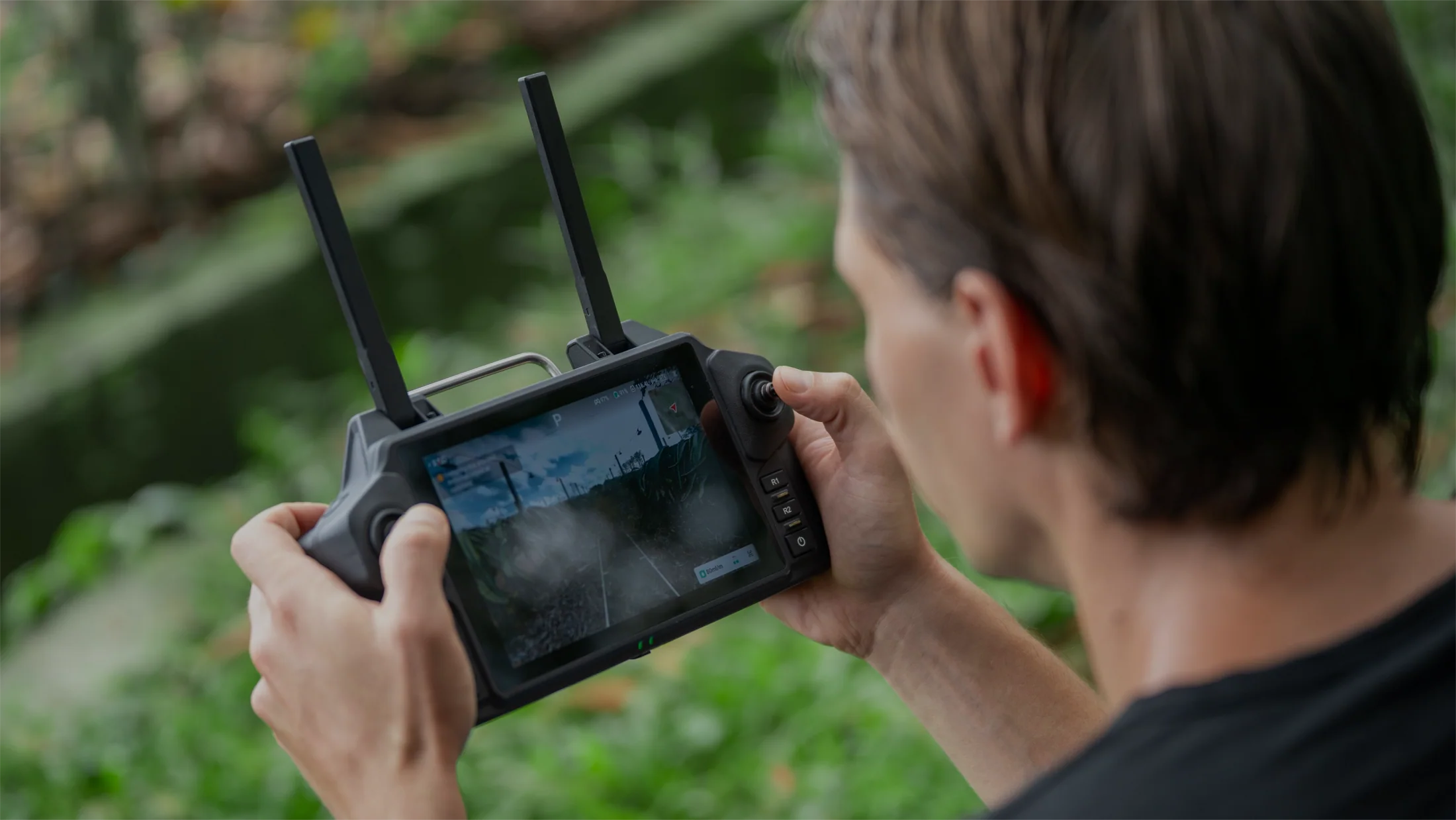 XAG SRC 5 Smart Remote Controller beside the R200